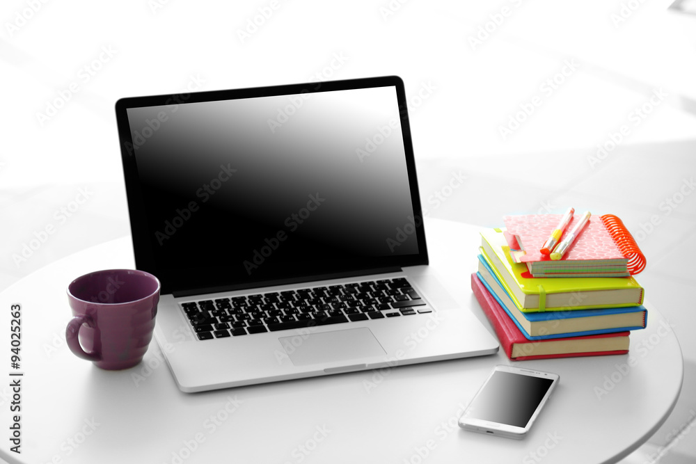 Desktop with notebook on window background Desktop with notebook on window background