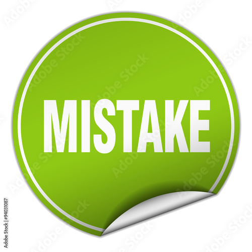 mistake round green sticker isolated on white