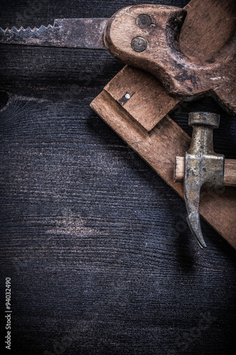 Vintage messy tools on wooden board construction concept