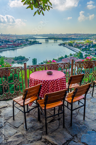 People are sitting pierre loti restaurant situated in the middle of graveyard in Istanbul. photo