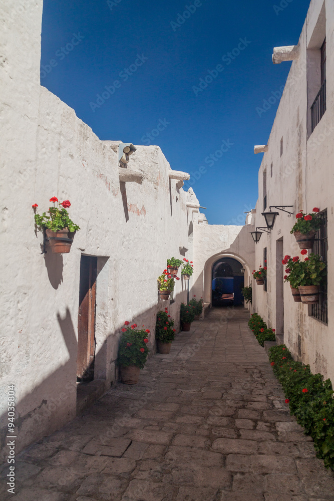 Alley with flowers in Santa Catalina monastery in Arequipa, Peru