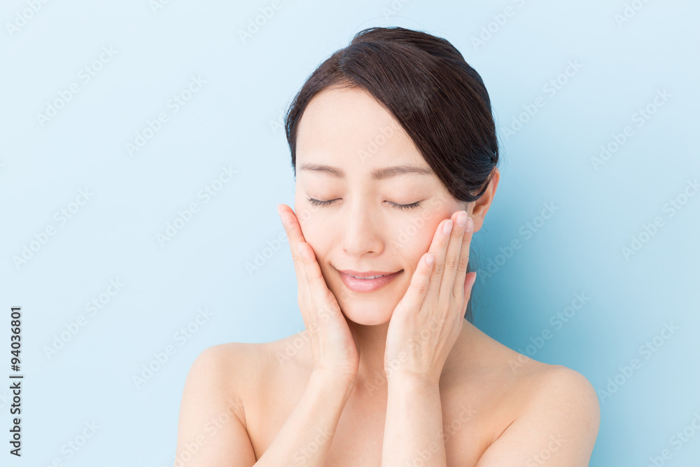 attractive asian woman beauty image on blue background attractive asian woman beauty image on blue background