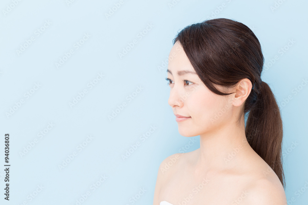 attractive asian woman beauty image on blue background attractive asian woman beauty image on blue background