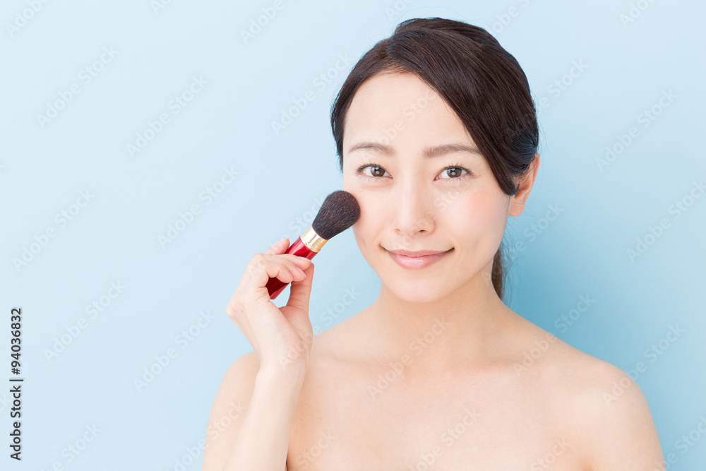 attractive asian woman beauty image on blue background attractive asian woman beauty image on blue background