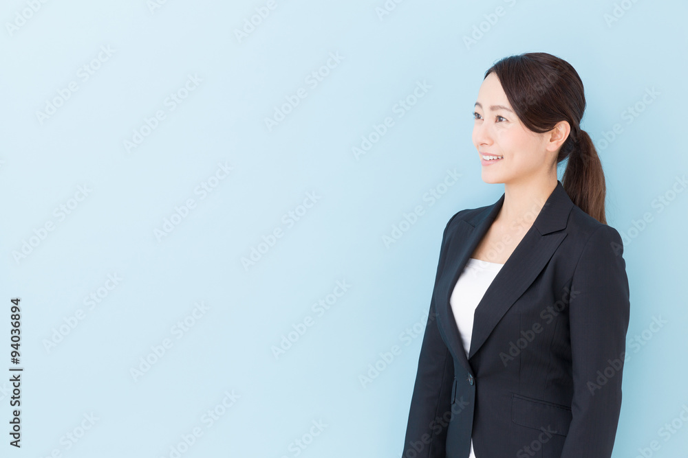 portrait of asian businesswoman on blue background portrait of asian businesswoman on blue background