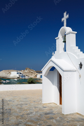 Small church and houses of Agios Konstantinos village in Milos island, Greece