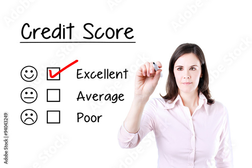 Hand putting check mark with red marker on excellent credit score evaluation form.  © sindler1