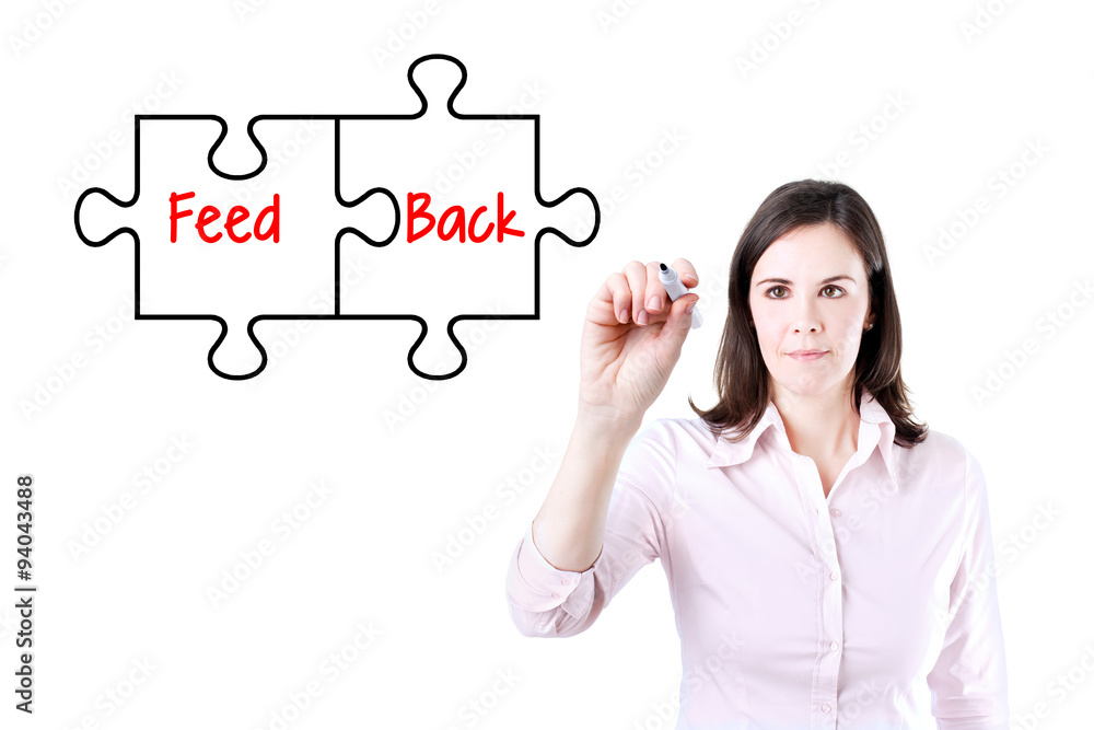 Businesswoman drawing a Feedback puzzle concept on the virtual screen.