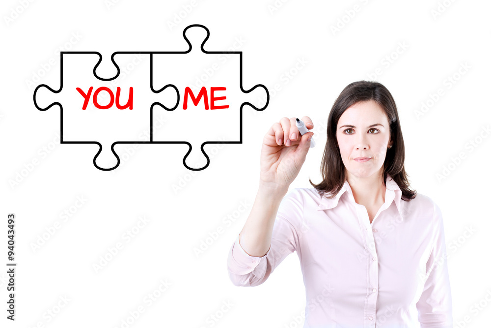 Businesswoman drawing a You and Me puzzle love concept on the virtual screen.