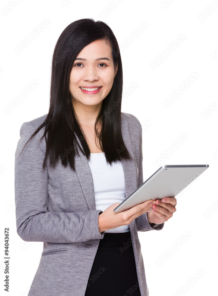 Asian Young Businesswoman use of the tablet pc Asian Young Businesswoman use of the tablet pc