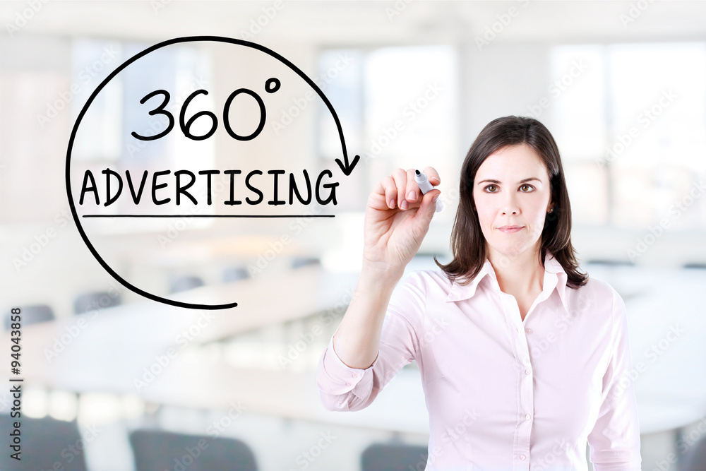 Businesswoman drawing a 360 degrees Advertising concept on the virtual screen. Office background. Businesswoman drawing a 360 degrees Advertising concept on the virtual screen. Office background.
