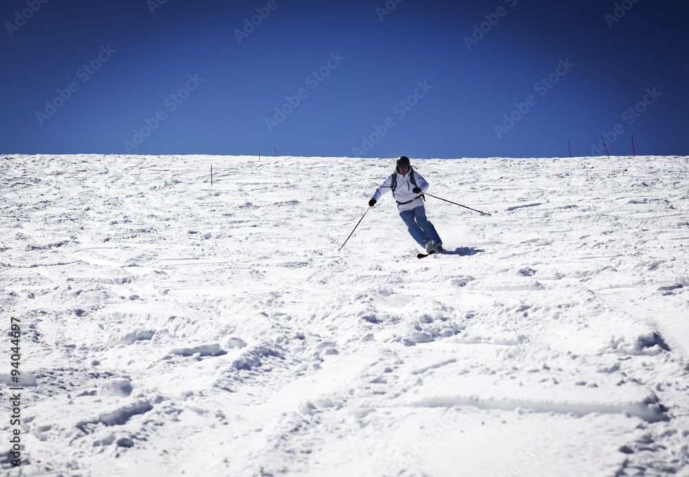 Man skiing on slope - winter holidays Man skiing on slope - winter holidays