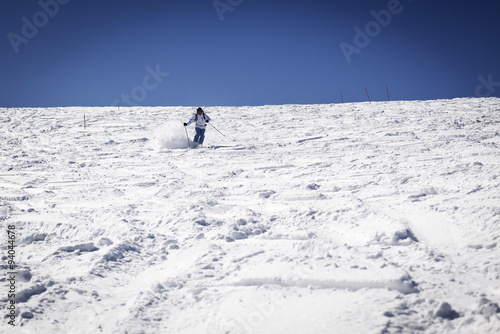 Man skiing on slope - winter holidays