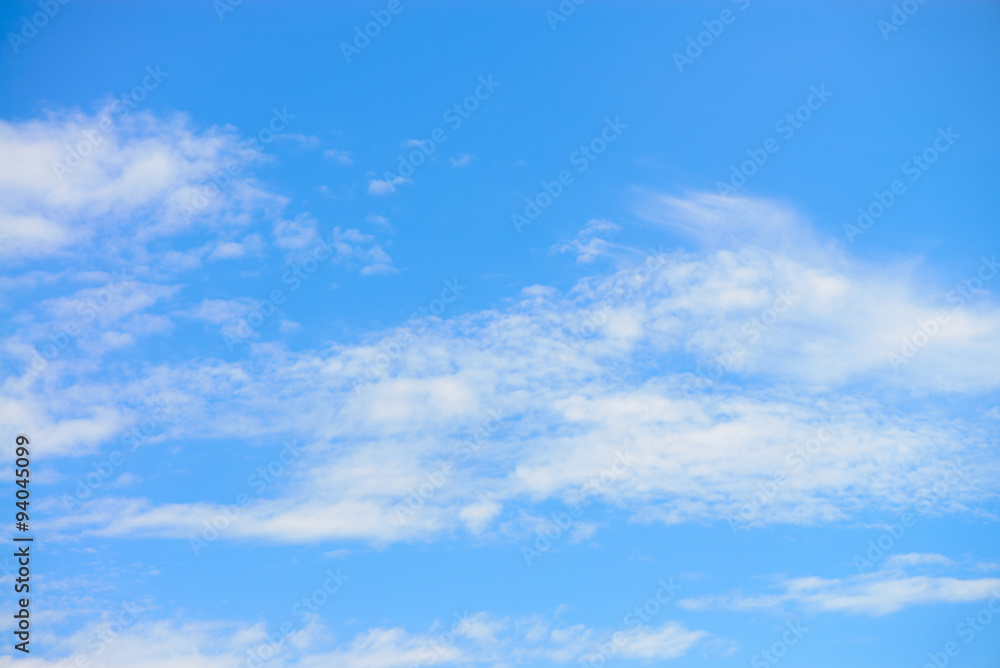 Blue sky with clouds background.