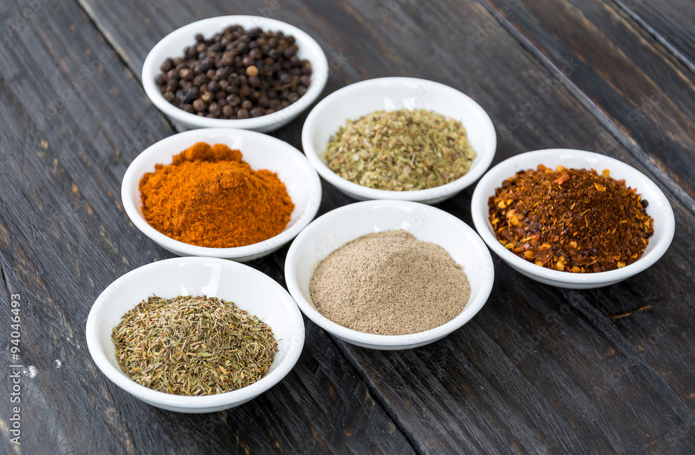 Spices and herbs in bowls. Spices and herbs in bowls.