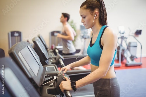Fit woman using the treadmill