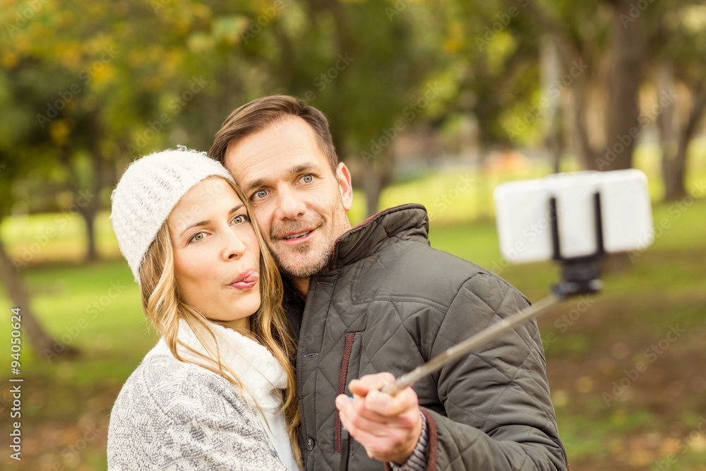 Smiling young couple taking selfies Smiling young couple taking selfies
