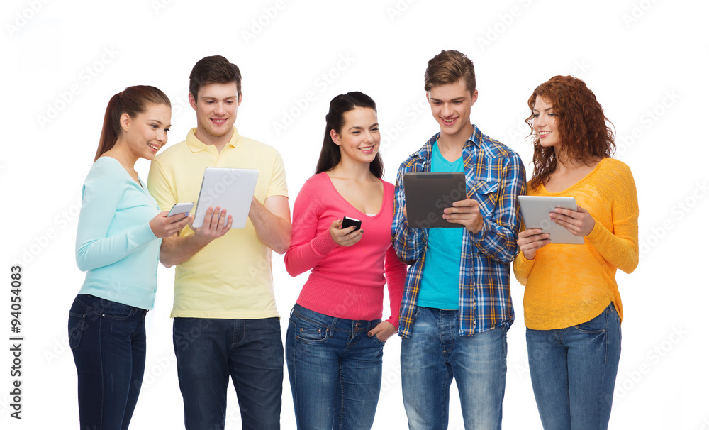group of teenagers with smartphones and tablet pc group of teenagers with smartphones and tablet pc