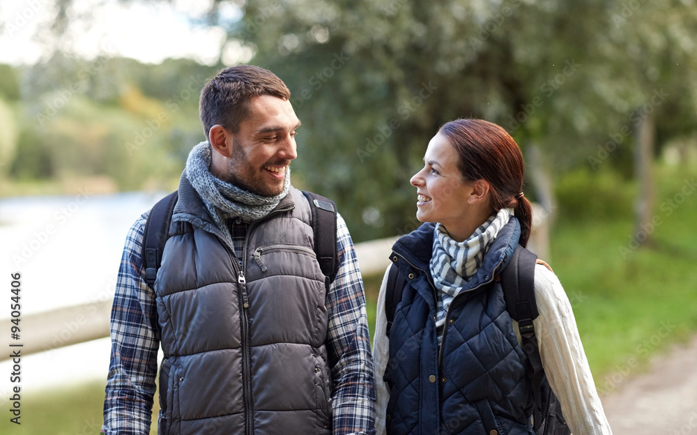 Fototapeta premium happy family walking with backpacks in woods