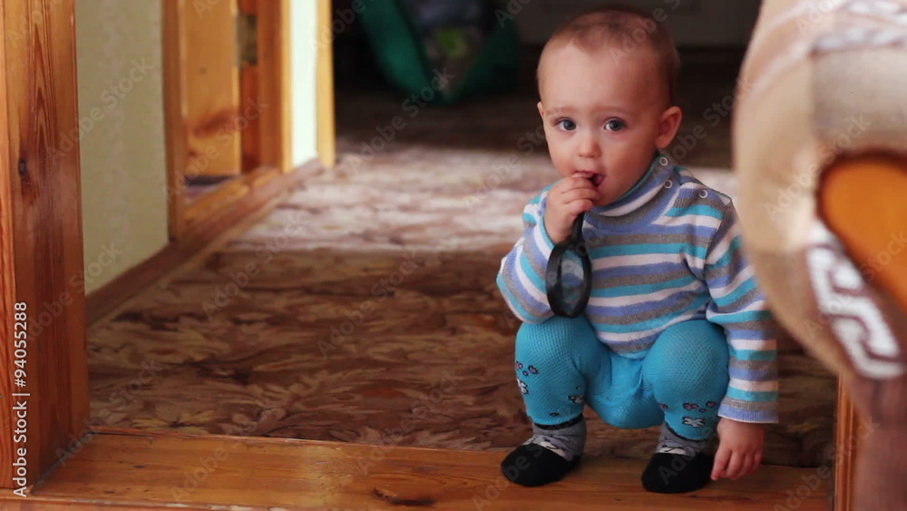 Little boy plays with toys and sharpens the teeth at home Little boy plays with toys and sharpens the teeth at home