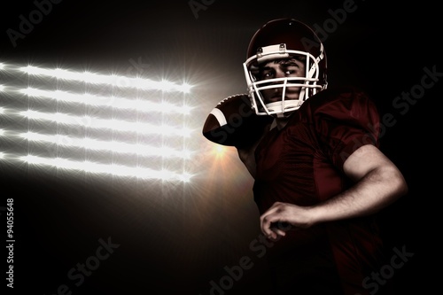 Composite image of american football player throwing a ball © vectorfusionart