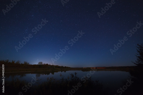 The stars in the night sky. Night landscape with a smooth surfac