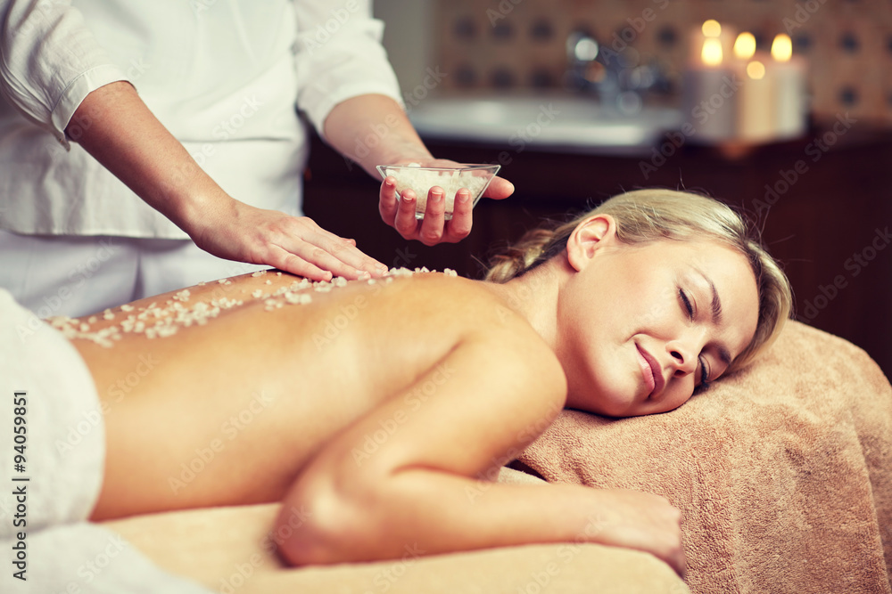 Fototapeta premium close up of woman lying and having massage in spa