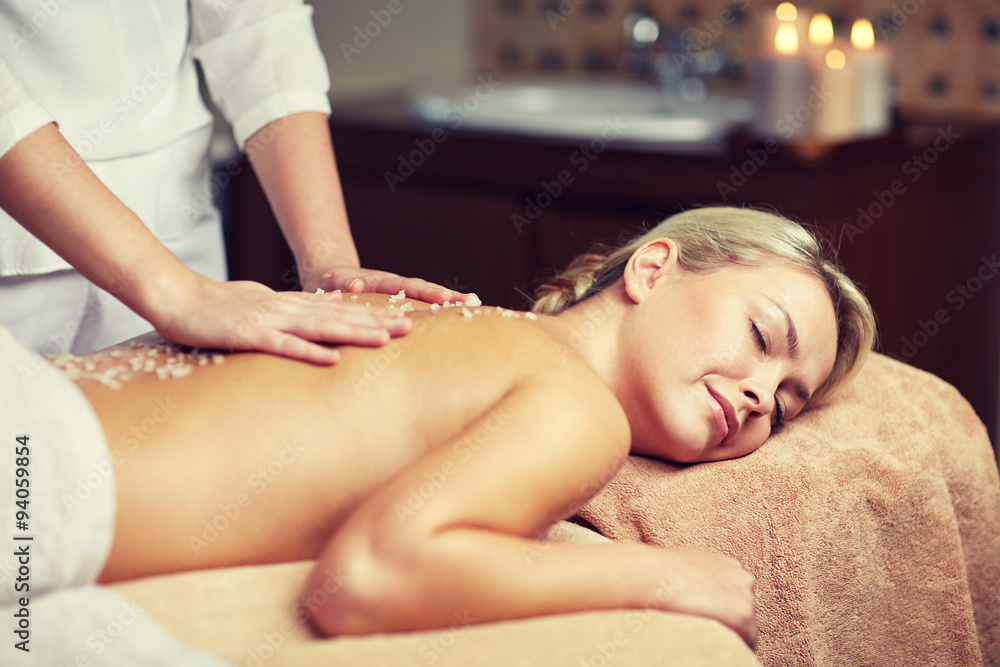 Fototapeta premium close up of woman lying and having massage in spa
