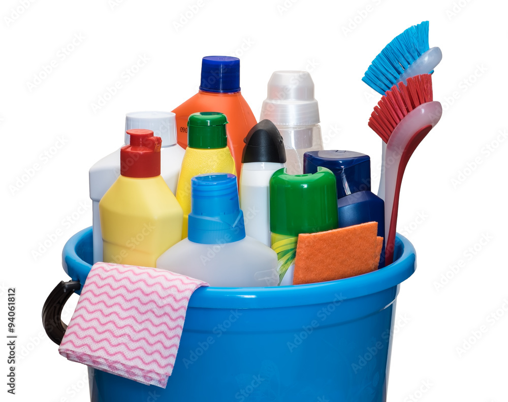 Set of detergents  in bottles with brush and napkins in a bucket. Isolated on white background.