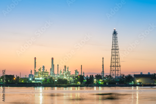 Oil refinery along the river at the early morning light.