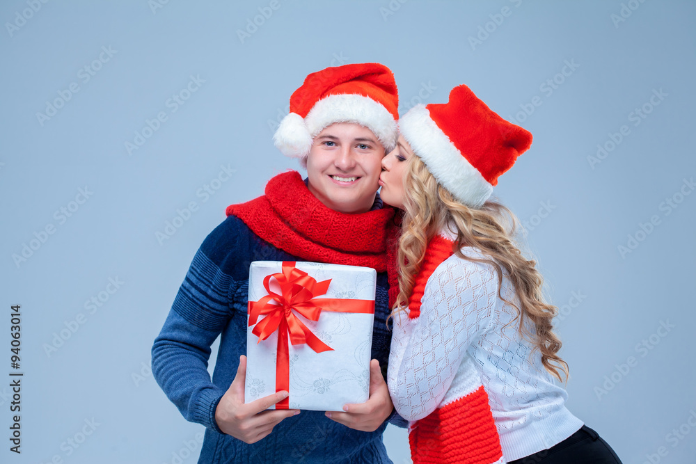 Lovely christmas couple holding presents Lovely christmas couple holding presents