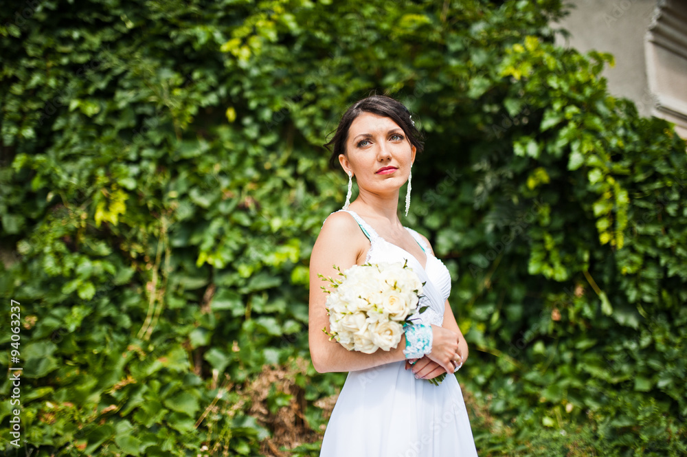 Brunette bride with wedding bouquet Brunette bride with wedding bouquet