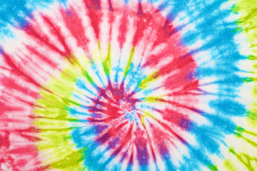 close up shot of spiral tie dye fabric texture background