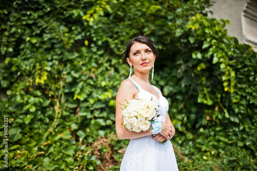 Brunette bride with wedding bouquet