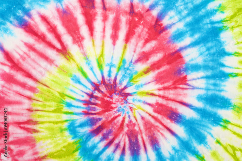 close up shot of spiral tie dye fabric texture background photo