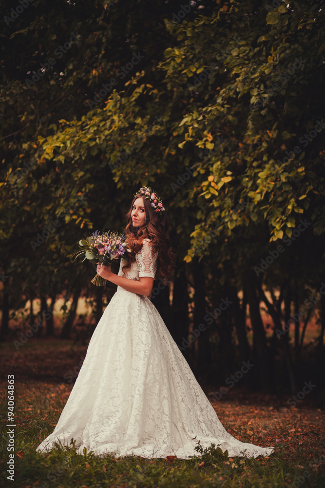 lovely brunette with a wreath and a bouquet