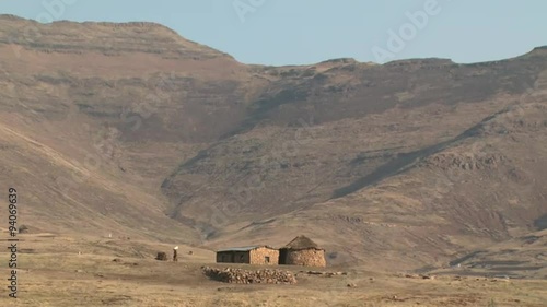 Basotho woman walking to her rural home in the Maloti mountains. photo