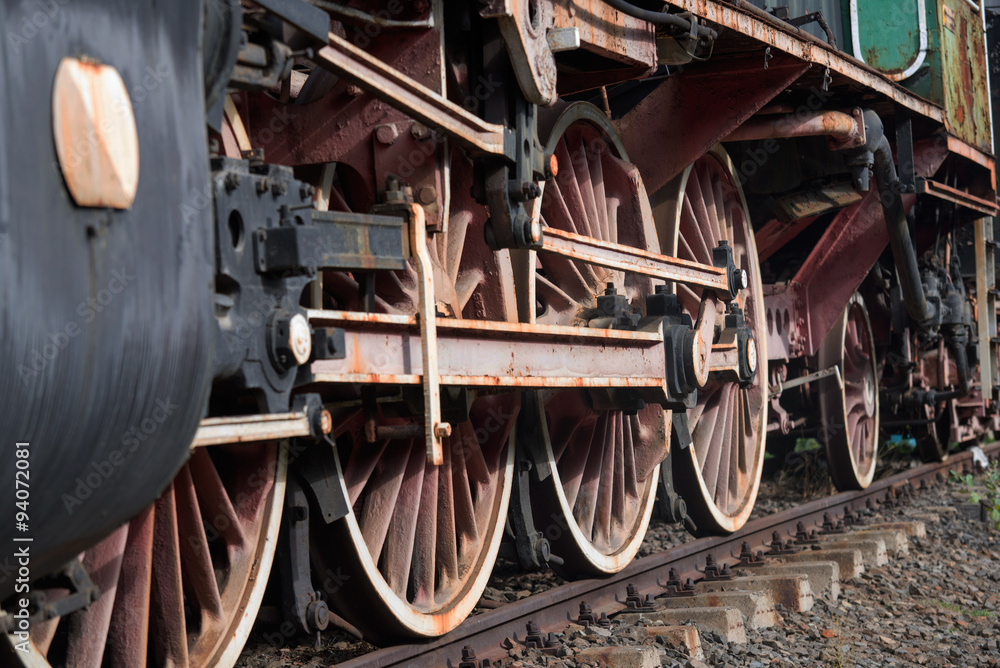 Old locomotive wheels close up