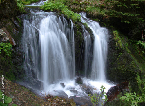 Fototapeta Naklejka Na Ścianę i Meble -  Waterfall long exposure landscape image in in the Protected area Jeseniky mountains Czech republic