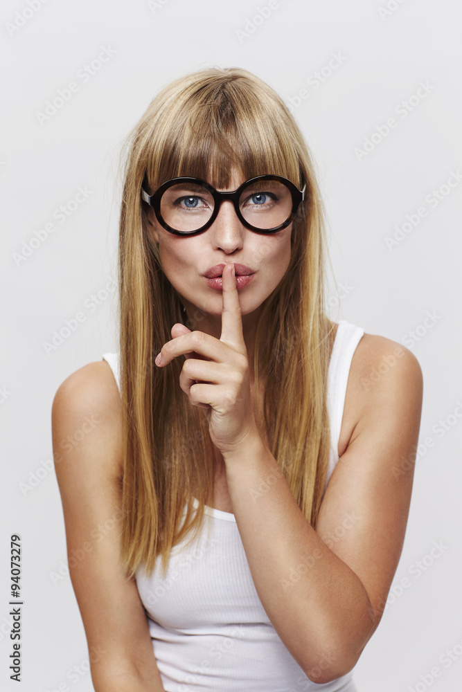 Young blond woman with a secret, portrait Young blond woman with a secret, portrait