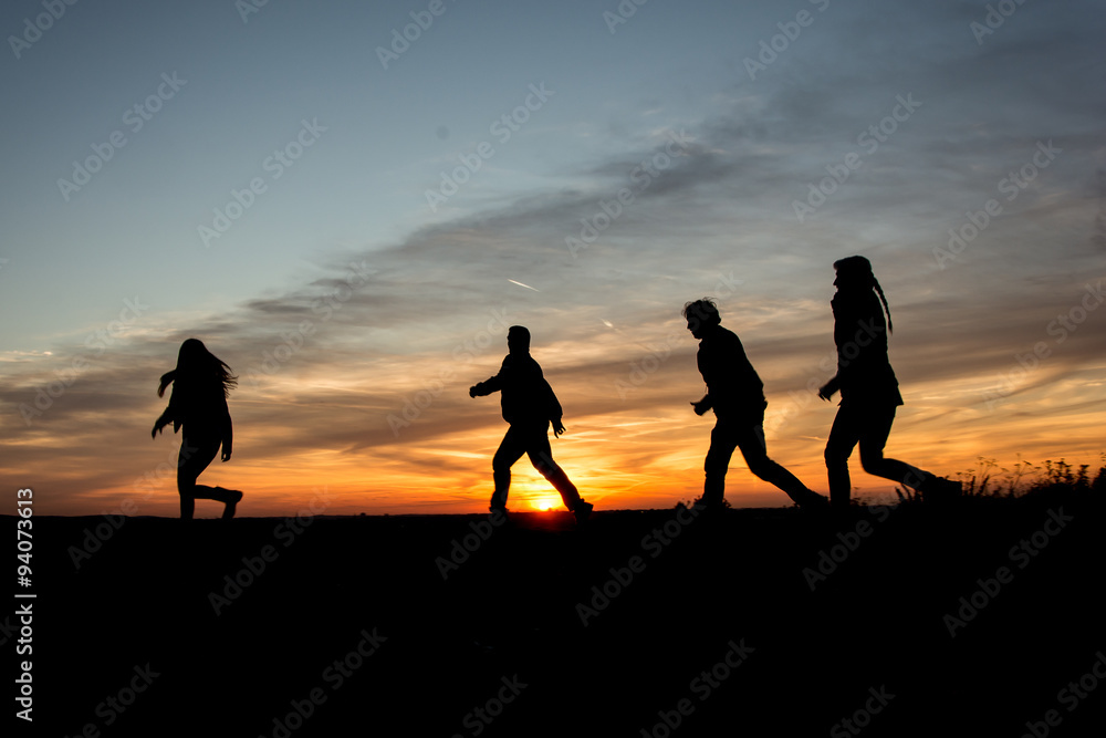 People Silhouette / Family Walking Together Through the sunset