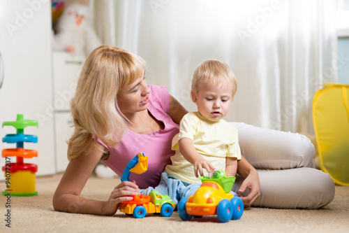 mother with child play toge...