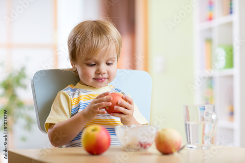 child eating healthy food w...