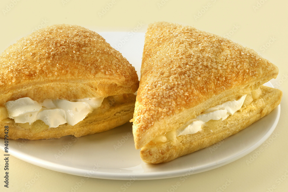 Plated fresh cream apple turnover dessert Plated fresh cream apple turnover dessert