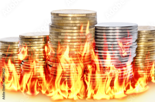 Burning financial savings isolated on white background photo