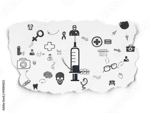 Health concept  Syringe on Torn Paper background