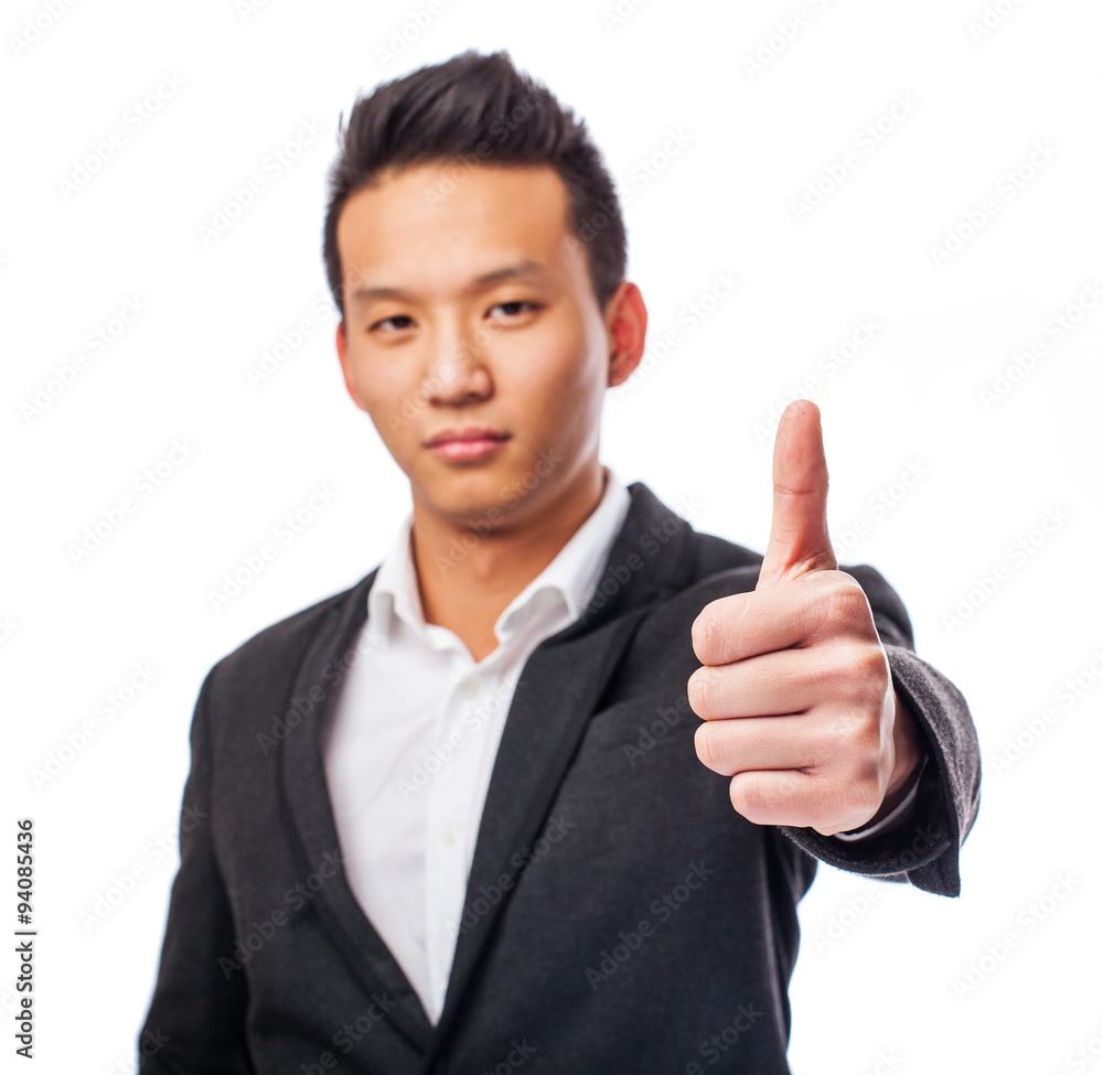 portrait of a young asian man with thumb up portrait of a young asian man with thumb up