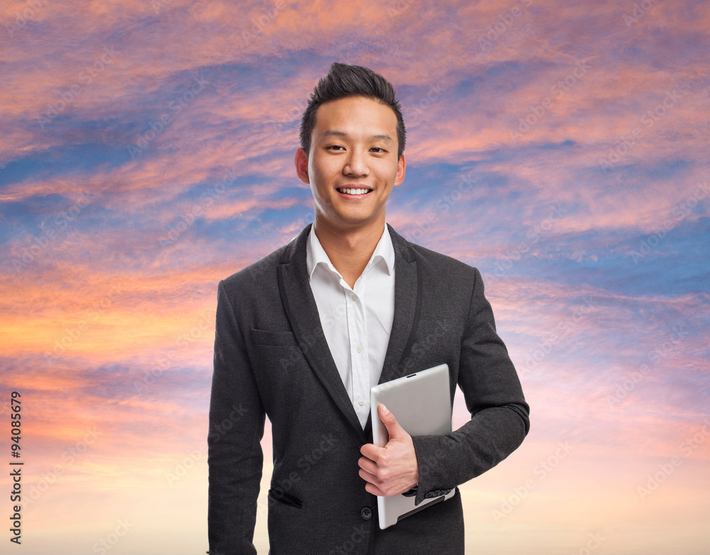 young business asian man using his tablet young business asian man using his tablet
