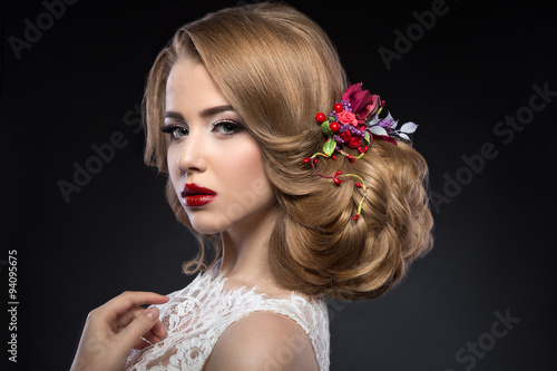 beautiful blond girl in image of the bride with purple flowers on her head. Beauty face.