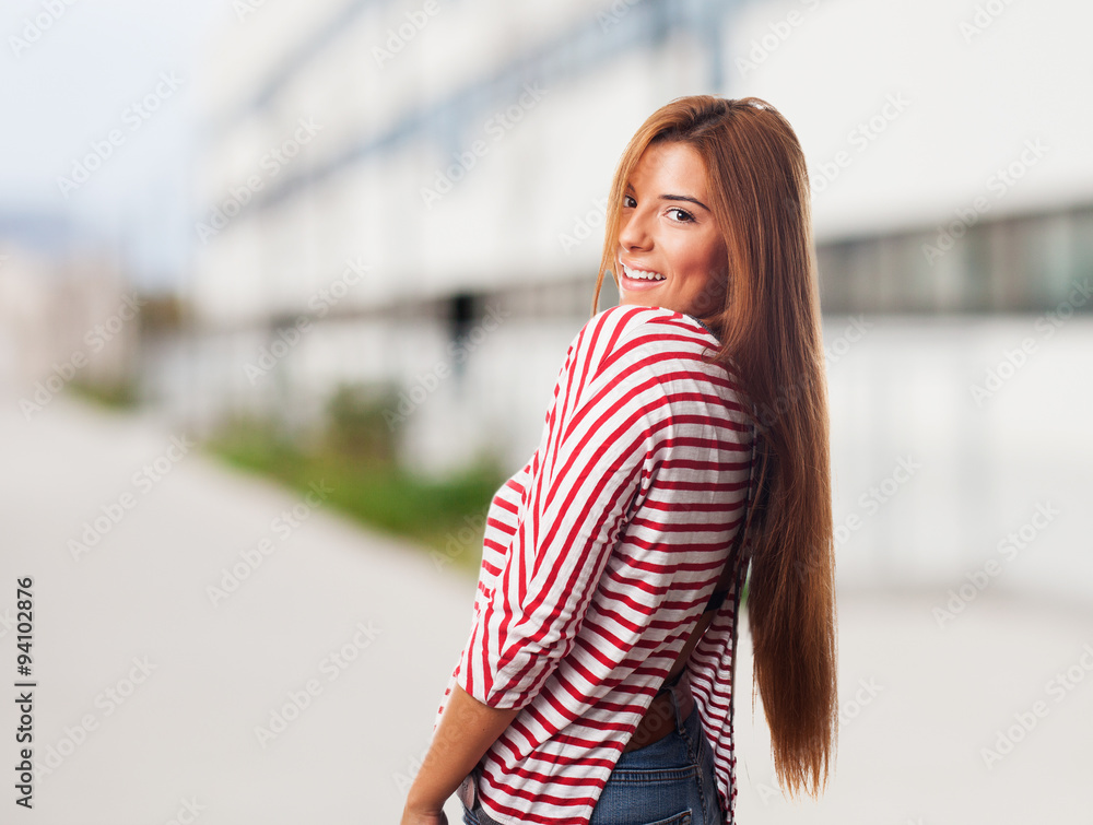 portrait of a pretty young woman posing with smiling gesture